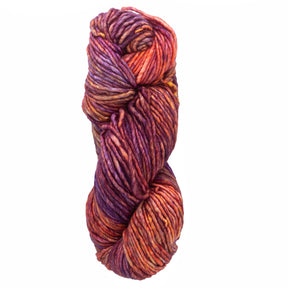 A skein of Malabrigo Mecha by Malabrigo Yarn, featuring vibrant shades of orange, purple, pink, and yellow twisted into a spiral. The kettle-dyed texture appears soft and chunky, making it ideal for knitting or crocheting cozy garments.