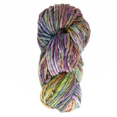 A skein of Malabrigo Yarn's super bulky Rasta yarn, made from luxurious merino wool, showcases vivid hues of purple, green, yellow, and pink woven into a simple white backdrop.