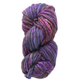 A skein of Malabrigo Rasta by Malabrigo Yarn, featuring thick, multi-colored yarn in shades of purple, pink, and blue. It is tightly wound to display the soft texture and variegated hues characteristic of super bulky merino wool.