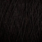 Close-up image of a bundle of dark black threads or yarn strands, tightly wound together with visible texture and slight variations in the direction of the fibers. The dense and soft Homestead 8/2 Cotton Yarn from Supreme Corp appears suitable for knitting, crocheting, or weaving projects, and is conveniently machine-washable. This large cone ensures you have ample material for your crafting needs.