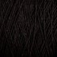 Close-up of Homestead 8/2 Cotton Yarn | Mini-cone by Supreme Corp. The tightly wound fibers create a dense, textured appearance with intertwining strands, highlighting the quality of this versatile black yarn.