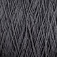 A close-up view of the Supreme Corp Homestead 8/2 Cotton Yarn | Mini-cone in dark gray reveals machine-washable yarn strands intricately intertwined to create a textured pattern. The soft and slightly fuzzy yarn fibers suggest a cozy material perfect for knitting or crocheting.