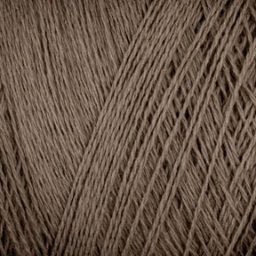 Close-up image of Supreme Corp's Homestead 8/2 Cotton Yarn on a large cone, showcasing the fine, tightly interwoven fibers. The texture appears soft and slightly fuzzy, indicative of natural fiber. The yarn strands are uniformly twisted, creating a consistent pattern across the image.