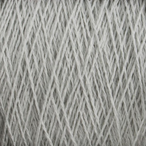 Close-up view of Supreme Corp's Homestead 8/2 Cotton Yarn | Large Cone in pale gray, wound neatly into a skein. The individual strands of this weaving yarn are tightly interwoven, creating a textured pattern. The image focuses on the details of the fibers and the uniformity of the winding.