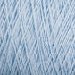 Close-up image of Homestead 8/2 Cotton Yarn from Supreme Corp in light blue, intricately woven together to create a dense, textured pattern. The versatile yarns are twisted and intertwined, forming a complex, uniform design that highlights the subtle variations in color and thickness.