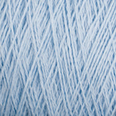 Close-up image of Homestead 8/2 Cotton Yarn from Supreme Corp in light blue, intricately woven together to create a dense, textured pattern. The versatile yarns are twisted and intertwined, forming a complex, uniform design that highlights the subtle variations in color and thickness.