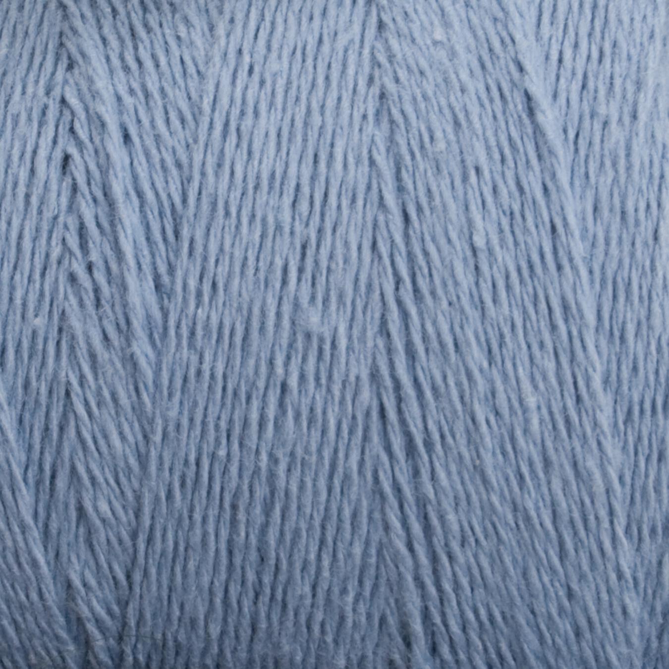 A close-up image of Homestead 8/2 Cotton Yarn from Supreme Corp in light blue, showcasing the intricate texture of the fibers. The yarn appears soft and slightly fuzzy, giving it a cozy, delicate look perfect for knitting or crocheting projects. Additionally, its machine-washable feature adds convenience to its charm.