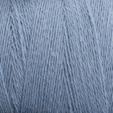 Close-up of a ball of Homestead 8/2 Cotton Yarn | Mini-cone by Supreme Corp in light blue, machine-washable yarn, showing the detailed texture of the fibers. The yarn is neatly wound, displaying a soft and smooth surface with fine strands intertwined together.