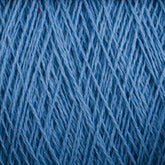 Close-up image of a spool of Supreme Corp's Homestead 8/2 Cotton Yarn in blue, showing its detailed woven fibers and texture. This machine-washable yarn appears tightly wound with a consistent thickness, making it ideal for all your weaving projects.