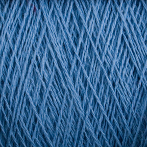 Close-up of Homestead 8/2 Cotton Yarn by Supreme Corp tightly wound together. The image captures the intricate and even texture of the threads, showcasing a detailed pattern of crisscrossing lines. This weaving yarn highlights the soft, fibrous quality and versatility that makes it perfect for various projects.