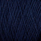 Close-up image of dark blue Homestead 8/2 Cotton Yarn | Large Cone by Supreme Corp, showing its texture and strands intertwined. The machine-washable yarn appears to be neatly wound, with fine, even fibers creating a consistent pattern.