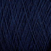 Close-up image of dark blue Homestead 8/2 Cotton Yarn | Large Cone by Supreme Corp, showing its texture and strands intertwined. The machine-washable yarn appears to be neatly wound, with fine, even fibers creating a consistent pattern.