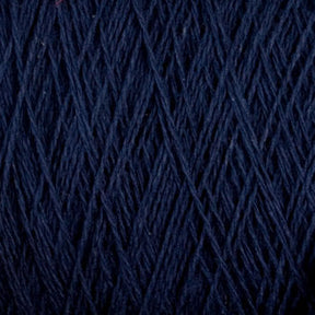 Close-up image of dark blue Homestead 8/2 Cotton Yarn | Large Cone by Supreme Corp, showing its texture and strands intertwined. The machine-washable yarn appears to be neatly wound, with fine, even fibers creating a consistent pattern.