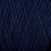 Close-up image of dark blue Homestead 8/2 Cotton Yarn by Supreme Corp, machine-washable and wrapped tightly in a mini-cone, showcasing its intricate and textured pattern.