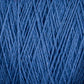 Close-up image of Supreme Corp's Homestead 8/2 Cotton Yarn in blue fibers arranged in an intricate, interwoven pattern. The texture is detailed, highlighting the strands and their varying thicknesses, creating a rich and tactile visual. This machine-washable weaving yarn offers both beauty and practicality.