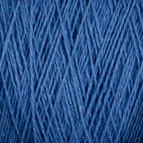 Close-up of multiple strands of blue Homestead 8/2 Cotton Yarn by Supreme Corp, machine-washable and intertwining in varying directions, creating a textured pattern. The yarn appears both thick and tightly wound, showcasing its fibrous consistency and intricate design.