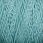 Close-up image of a light blue-colored cone of Homestead 8/2 Cotton Yarn by Supreme Corp, revealing the intricate, intertwined strands that create a textured pattern. The yarn appears soft and slightly fluffy, designed for knitting, crocheting, or other fiber crafts. This machine-washable yarn is perfect for all your creative projects.