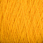 Close-up of a ball of bright yellow Homestead 8/2 Cotton Yarn from Supreme Corp. The detailed texture reveals interwoven strands with a soft, fibrous appearance. This vibrant yarn is ideal for weaving and machine-washable, ensuring ease and durability throughout your projects.