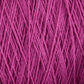 Close-up image of a bundle of magenta-colored Homestead 8/2 Cotton Yarn | Large Cone by Supreme Corp, tightly wound together. The threads appear to be thin and slightly textured, forming a dense and intricate pattern ideal for weaving yarn projects.