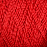 Close-up image showing the intricate and detailed texture of tightly wound Homestead 8/2 Cotton Yarn | Large Cone from Supreme Corp. The fibers of this machine-washable yarn are arranged in a crisscross pattern, highlighting the different shades and thicknesses of the red strands.