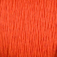 Close-up of the Supreme Corp Homestead 8/2 Cotton Yarn in orange. The threads on the large cone are tightly packed, showcasing a rich and vivid orange hue with a slightly textured and fibrous appearance.