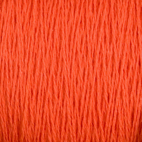 Close-up of the Supreme Corp Homestead 8/2 Cotton Yarn in orange. The threads on the large cone are tightly packed, showcasing a rich and vivid orange hue with a slightly textured and fibrous appearance.