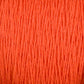 Close-up image of Supreme Corp's Homestead 8/2 Cotton Yarn | Mini-cone in bright orange, showcasing the texture and detail of the individual strands intertwined together. This versatile yarn appears soft and thick, making it ideal for both knitting and crocheting. The background is completely filled with yarn, emphasizing its vivid color.