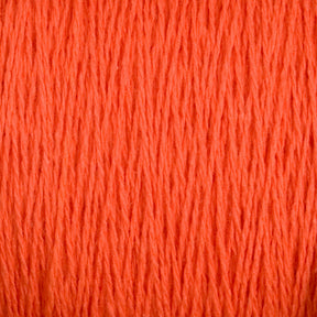 Close-up image of Supreme Corp's Homestead 8/2 Cotton Yarn | Mini-cone in bright orange, showcasing the texture and detail of the individual strands intertwined together. This versatile yarn appears soft and thick, making it ideal for both knitting and crocheting. The background is completely filled with yarn, emphasizing its vivid color.