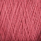 A close-up of Supreme Corp's Homestead 8/2 Cotton Yarn texture, showing intertwined strands of soft, fibrous thread. The yarn maintains a consistent color and thickness, resulting in a dense and intricate pattern perfect for knitting, crocheting, or other textile crafts. This weaving yarn comes in a large cone and is machine-washable for added convenience.