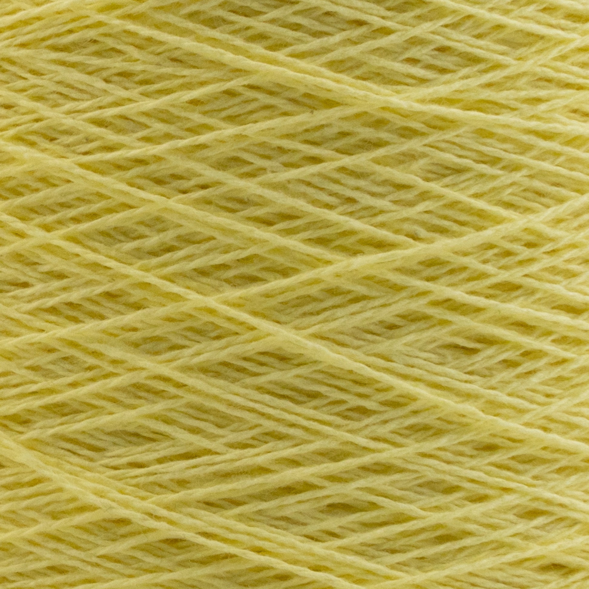 Close-up image of Homestead 8/2 Cotton Yarn | Mini-cone by Supreme Corp, wound in a crisscross pattern, showing the detailed texture and fibers of this versatile yarn. The bright yellow color dominates the image, creating a warm and sunny visual appeal.