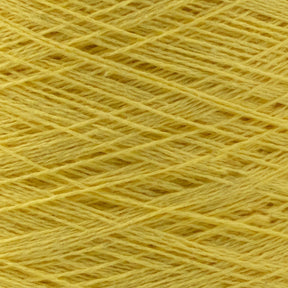 Close-up of a ball of light yellow Homestead 8/2 Cotton Yarn from Supreme Corp, showing the tightly wound threads in a crisscross pattern. The yarn appears soft, consistent in thickness, and perfect for weaving or other crafting projects.