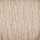 A close-up image of Homestead 8/2 Cotton Yarn | Mini-cone by Supreme Corp, showcasing tightly wound beige fibers running vertically. The texture appears rough, with strands slightly uneven, creating a natural, rustic look reminiscent of versatile yarns.