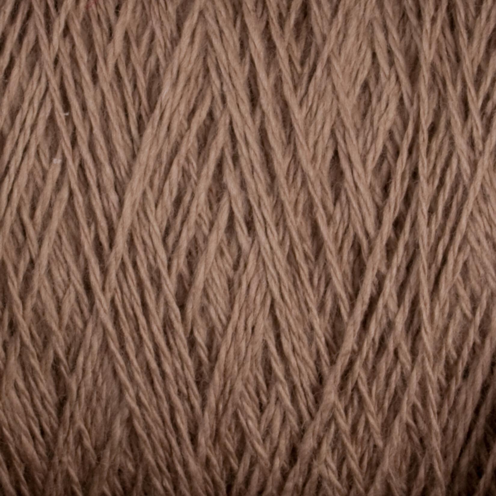 Close-up image of Homestead 8/2 Cotton Yarn | Large Cone by Supreme Corp, showcasing a detailed view of the tightly woven fibers. The texture is soft and smooth, with the strands interlaced in a consistent pattern. This machine-washable yarn exemplifies quality and ease of care.