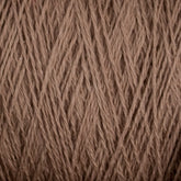 Close-up view of Homestead 8/2 Cotton Yarn | Mini-cone by Supreme Corp, showcasing the tightly interwoven strands of brown yarn with a slightly coarse texture. The versatile yarn appears uniform and densely packed, highlighting its fibrous details.