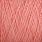 Close-up of Supreme Corp's Homestead 8/2 Cotton Yarn in pink, revealing strands intertwined to form a dense and textured pattern. The yarn is soft and finely spun, with threads crisscrossing each other to create an intricate and detailed fabric-like surface that is conveniently machine-washable.