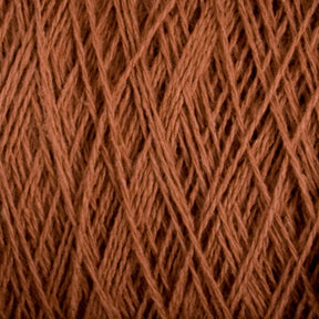 Close-up image of Supreme Corp's Homestead 8/2 Cotton Yarn in brown, showcasing tightly wound strands crisscrossing in a complex weaving pattern. The texture of the fibers is clearly visible, emphasizing the intertwined and slightly fuzzy nature of this machine-washable yarn on a large cone.