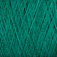 Close-up image of green Supreme Corp Homestead 8/2 Cotton Yarn wound tightly in a ball, showcasing its fibrous texture and crisscrossing strands. The yarn appears soft and smooth, suitable for knitting, crocheting, or other textile crafts. Plus, it's machine-washable for easy care.