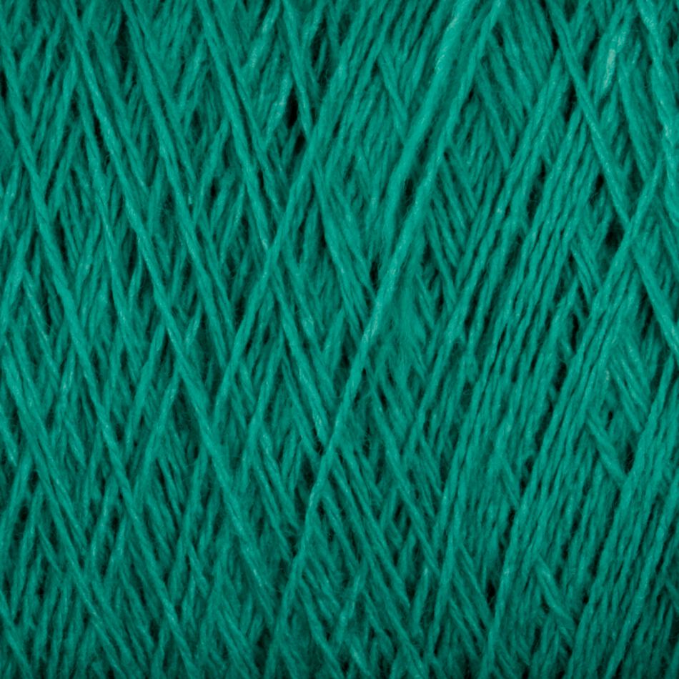 Close-up image of green Supreme Corp Homestead 8/2 Cotton Yarn wound tightly in a ball, showcasing its fibrous texture and crisscrossing strands. The yarn appears soft and smooth, suitable for knitting, crocheting, or other textile crafts. Plus, it's machine-washable for easy care.