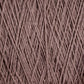 A close-up image of a ball of Supreme Corp's Homestead 8/2 Cotton Yarn | Large Cone. The yarn strands are neatly wound and crisscrossed, creating a textured pattern. The color is a solid, earthy brown, reminiscent of the Homestead Cotton collection, and the overall appearance is soft and fibrous.