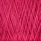 Close-up of Supreme Corp's Homestead 8/2 Cotton Yarn in vibrant pink, intricately wound in a crisscross pattern. The texture of the fibers is clearly visible, displaying the soft and slightly fluffy nature of this machine-washable material on a large cone. The vivid pink color dominates the image.