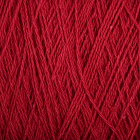 Close-up view of a textured red yarn. The strands are interwoven, showcasing the intricate weaving pattern. This Supreme Corp Homestead 8/2 Cotton Yarn | Large Cone focuses on the rich, solid red color and its fine, slightly fuzzy texture, all while being machine-washable for your convenience.