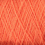 Close-up image of orange Homestead 8/2 Cotton Yarn | Large Cone by Supreme Corp, intricately layered, creating a textured pattern. The strands are thin, tightly intertwined, and evenly spaced, showcasing the detailed structure of the weaving yarn. Plus, it's machine-washable for easy care.