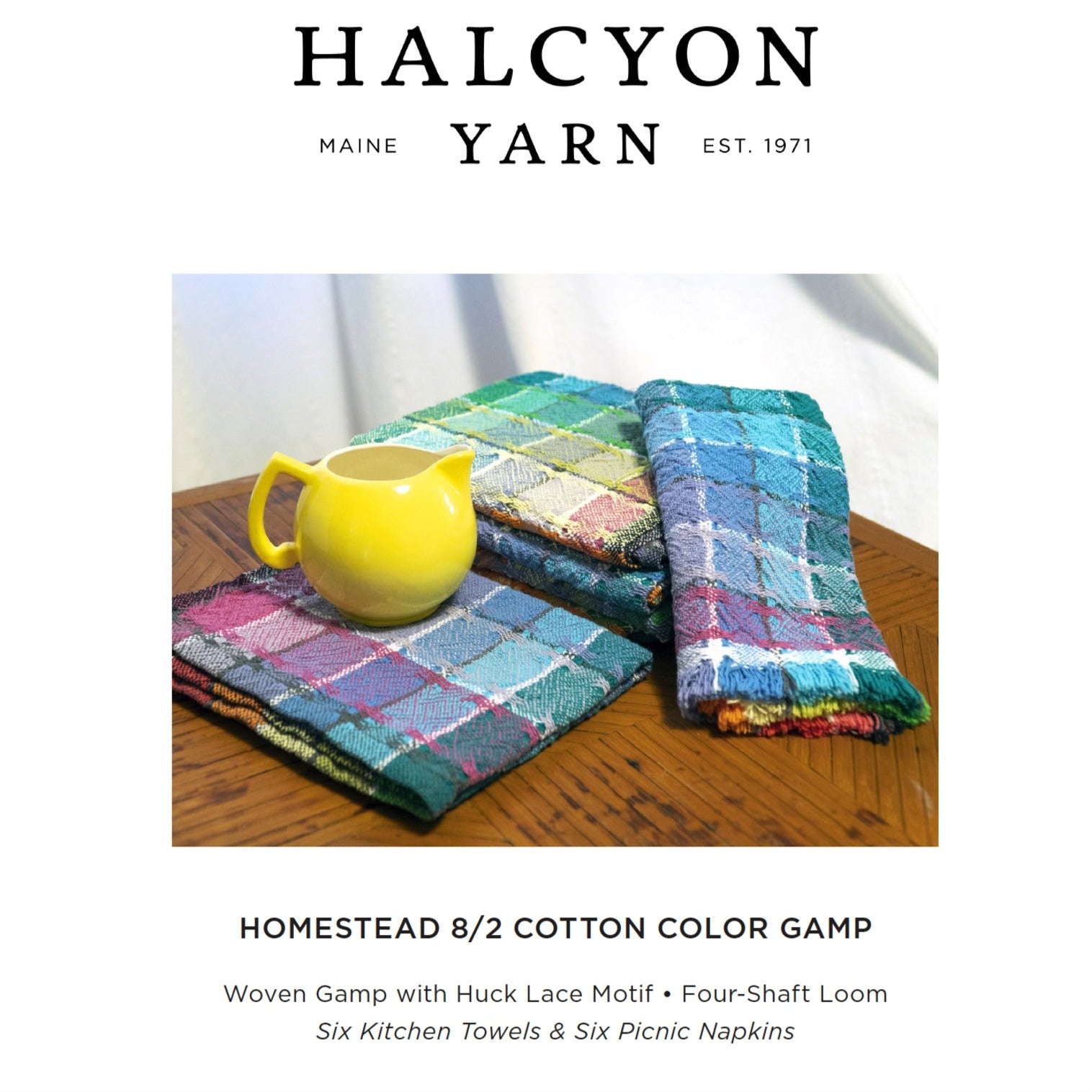 Displayed beside a yellow ceramic pitcher, an image features the Homestead Cotton Color Gamp by Halcyon Yarn. The vibrant fabric pieces, created with a four-shaft loom and adorned with a huck lace motif, showcase a colorful mix of blues, greens, and pinks that are perfect for kitchen towels. Caption reads: "HOMESTEAD 8/2 COTTON COLOR GAMP" with additional product details.