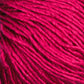 Close-up view of Halcyon Yarn's Gemstone Soft Twist Silk Yarn, showcasing a ball of vibrant red silk with a slightly glossy texture. The fibers, resembling soft twist silk, are wound in a loose pattern that highlights its thickness and softness.