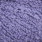 Close-up image of soft, textured purple yarn with a bouclé appearance. The Gemstone Silk Bouclé by Halcyon Yarn features small loops, creating a bumpy and fluffy texture, ideal for knitting or crocheting cozy garments and accessories.