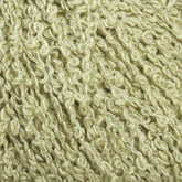 Close-up image of Halcyon Yarn's Gemstone Silk Bouclé in a light beige color. The textured yarn exhibits a curly and irregular pattern, giving it a soft and bumpy appearance. The image emphasizes the intertwined strands and intricate details of the fiber.