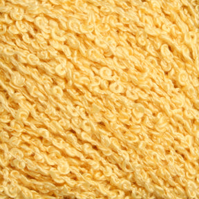 A close-up view of a ball of Gemstone Silk Bouclé by Halcyon Yarn. The yarn boasts a textured appearance with numerous small, tight loops, resulting in a bumpy and curly look. The shade of yellow is both soft and vibrant, reminiscent of golden sunshine.