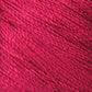 Close-up of a vibrant, rich red Gemstone Silk 2/12 yarn by Halcyon Yarn. The texture of the yarn is smooth and slightly shiny, with individual strands and fibers clearly visible. The color is uniform throughout the image, highlighting the intricacies of the woven threads, reminiscent of luxurious gemstone silks.