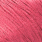 Close-up of Halcyon Yarn's Gemstone Silk 2/12, tightly wound into a compact ball. The texture shows multiple strands twisted together, creating a soft, fibrous surface with a slight sheen. The color is a consistent shade of vibrant pink throughout, perfect for weaving or knitting intricate patterns.