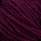 Close-up of a ball of dark purple Victorian 2-Ply Wool Yarn by Halcyon Yarn, showing its soft, textured strands coiled together tightly, with a few stray fibers visible. Perfect for hand knitting projects, this sport weight wool promises both comfort and durability.